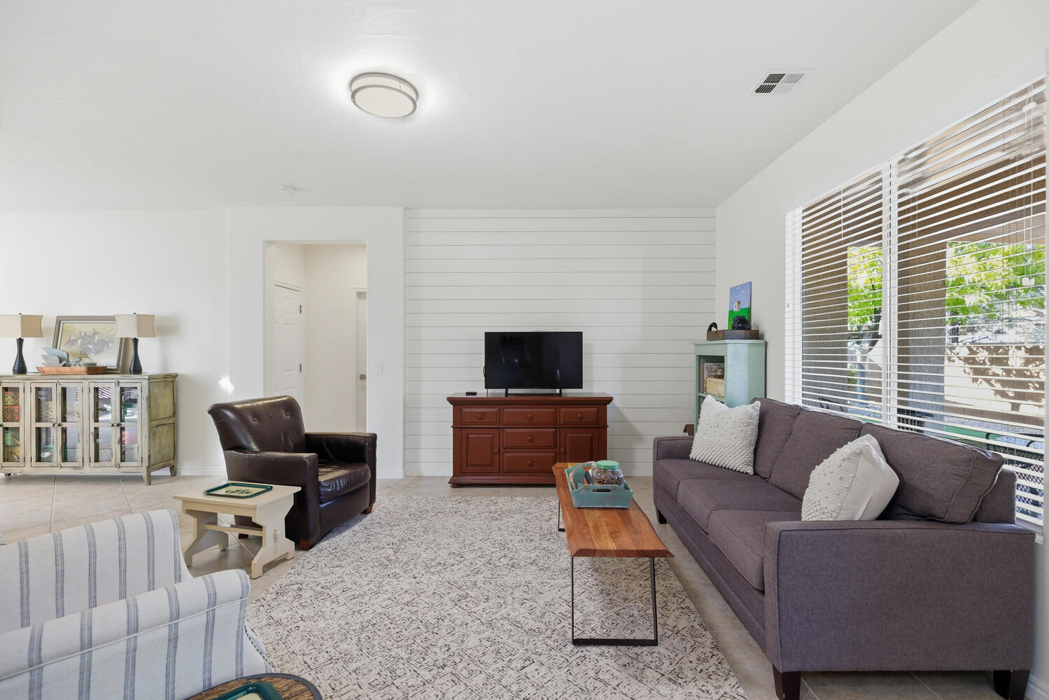 Living area featuring tile patterned floors