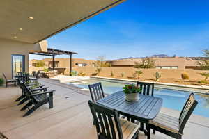 Fenced backyard with outdoor dining space and a patio area
