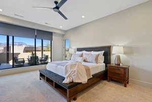 Bedroom with access to exterior, light colored carpet, ceiling fan, a mountain view, and recessed lighting