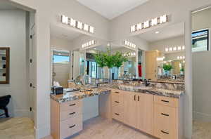Bathroom with vanity and a shower stall