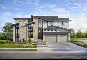 Modern home featuring stone siding, a garage, and driveway