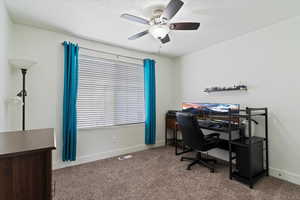 Bedroom featuring baseboards and carpet
