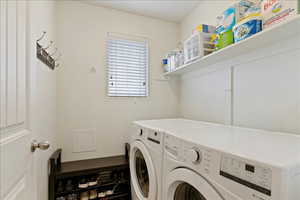 Laundry area featuring independent washer and dryer