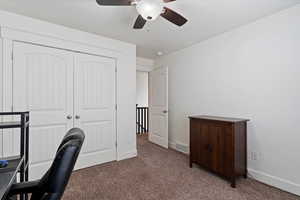 Bedroom featuring baseboards and carpet