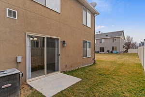 Rear view of house with stucco siding