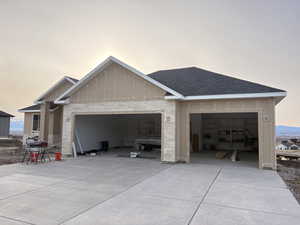 Garage at dusk with driveway