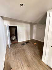 Empty room featuring wood finished floors and baseboards