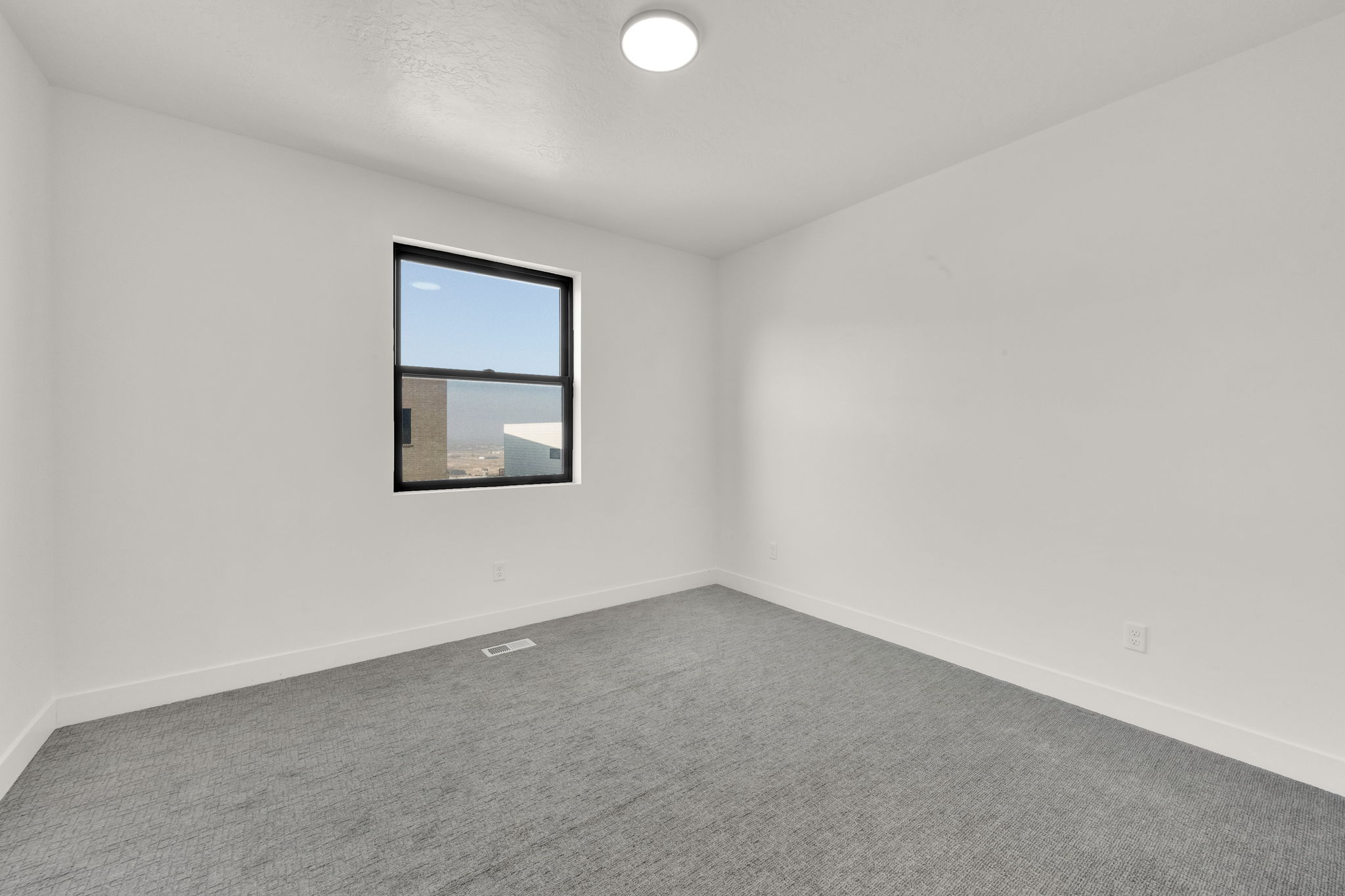 Unfurnished room with carpet and baseboards