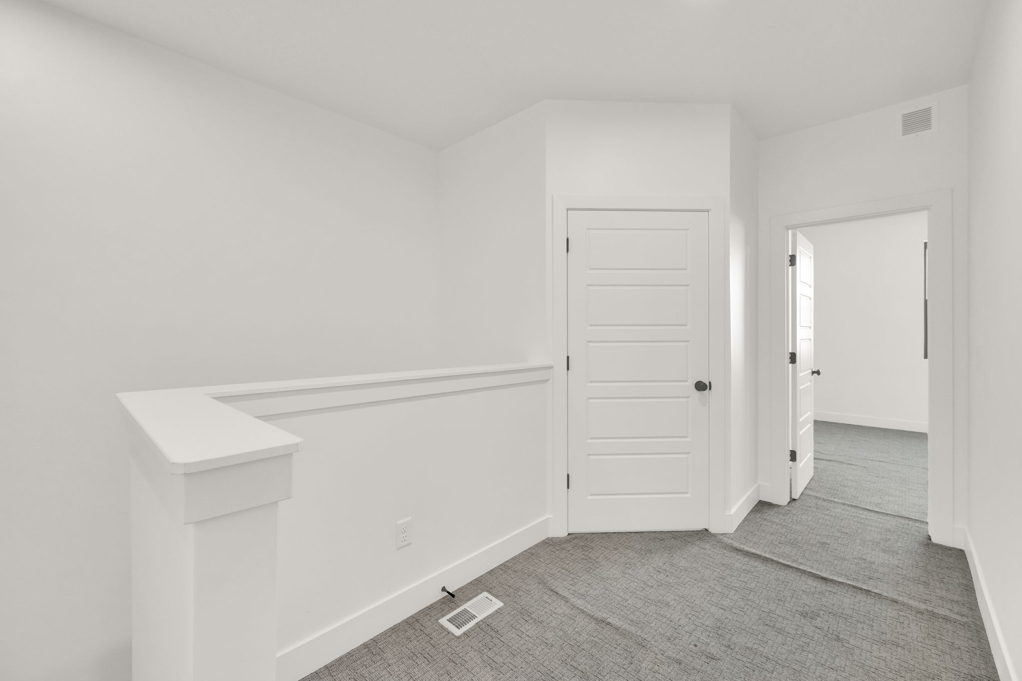 Empty room featuring carpet floors and baseboards