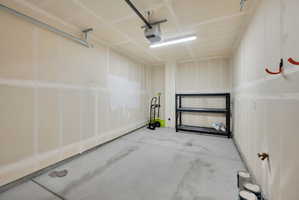Garage featuring a garage door opener