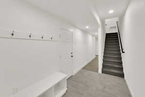 Mudroom with baseboards and recessed lighting