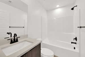 Bathroom featuring vanity and bathtub / shower combination