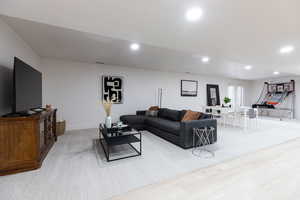 Living room featuring recessed lighting and light wood-type flooring
