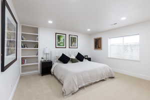 Carpeted bedroom featuring recessed lighting