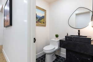 Bathroom featuring vanity and toilet