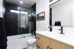 Full bathroom featuring vanity and combined bath / shower with glass door