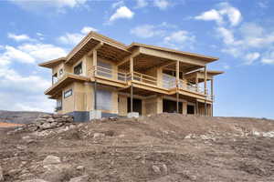Rear view of property with a wooden deck