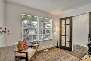 Office space featuring wood finished floors and baseboards