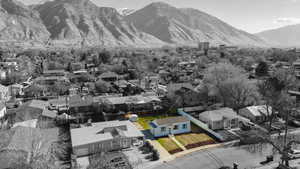 Aerial perspective of suburban area with a mountain backdrop