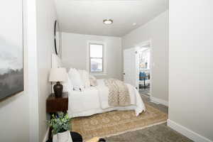 Carpeted bedroom with baseboards