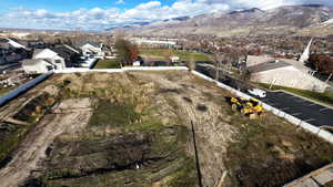 Aerial view of residential area featuring a mountain backdrop