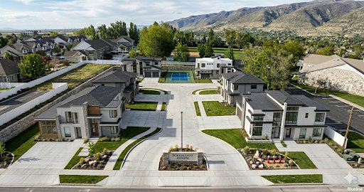 Modern residential development featuring contemporary architecture with stone and stucco exteriors