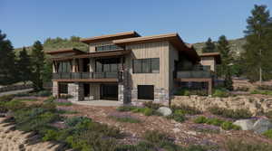 Rear view of house with stone siding, a patio area, and a sunroom