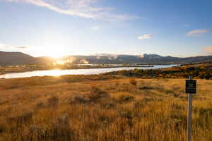 View of mountain backdrop featuring a large body of water