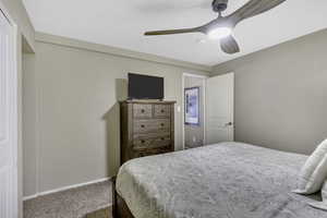 Bedroom with carpet floors and a ceiling fan
