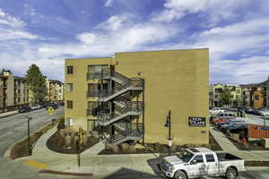 View of apartment building / complex with stairs