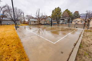 View of sport court with community basketball court and a residential view