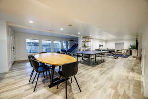 Game room with recessed lighting and light wood-type flooring