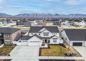 Aerial perspective of suburban area featuring a mountainous background