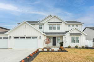 Modern inspired farmhouse with board and batten siding, a shingled roof, concrete driveway, and a porch