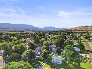 Aerial perspective of suburban area featuring a mountain backdrop