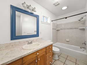 Full bathroom featuring vanity, shower / washtub combination, and light tile patterned flooring