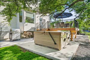 View of patio featuring a grill and a hot tub