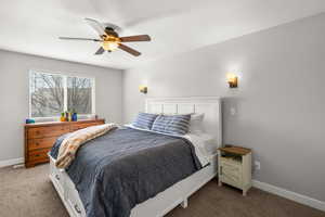 Primary Bedroom featuring carpet flooring and ceiling fan
