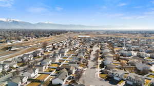 Aerial perspective of suburban area featuring a mountainous background