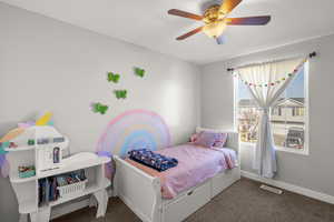 Bedroom featuring carpet and ceiling fan