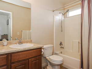 Full bath with vanity and shower / tub combo with curtain
