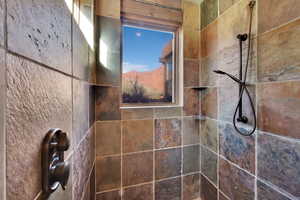 Full bath with tiled shower