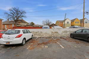 Uncovered parking lot with a residential view
