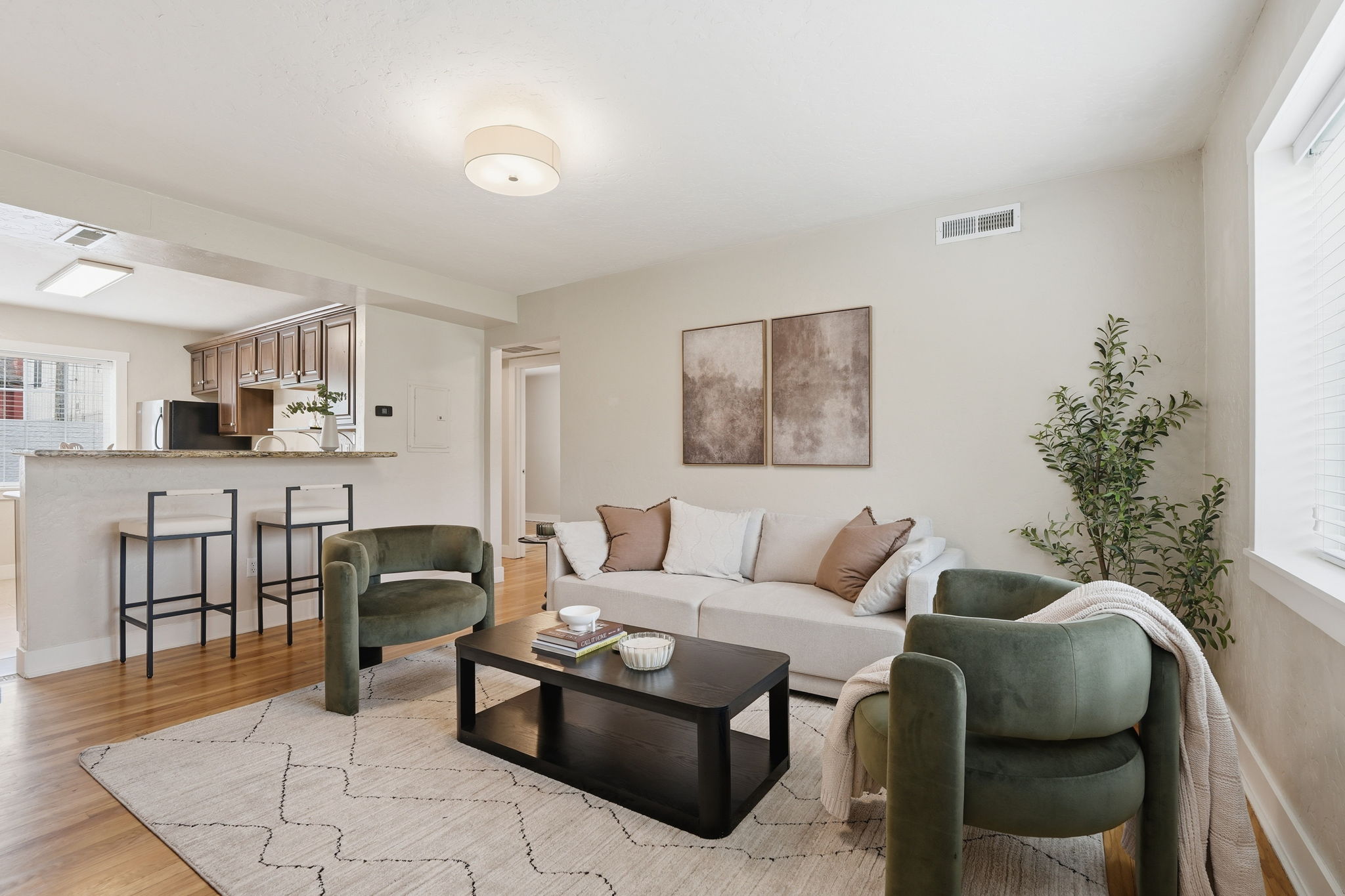 Living room with light wood-type flooring and baseboards