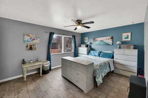 Bedroom featuring light wood-style flooring and a ceiling fan