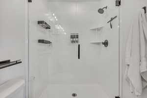 Bathroom featuring a shower stall