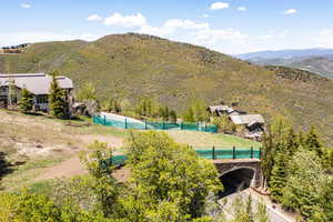 Bird's eye view of a mountain backdrop and a pool