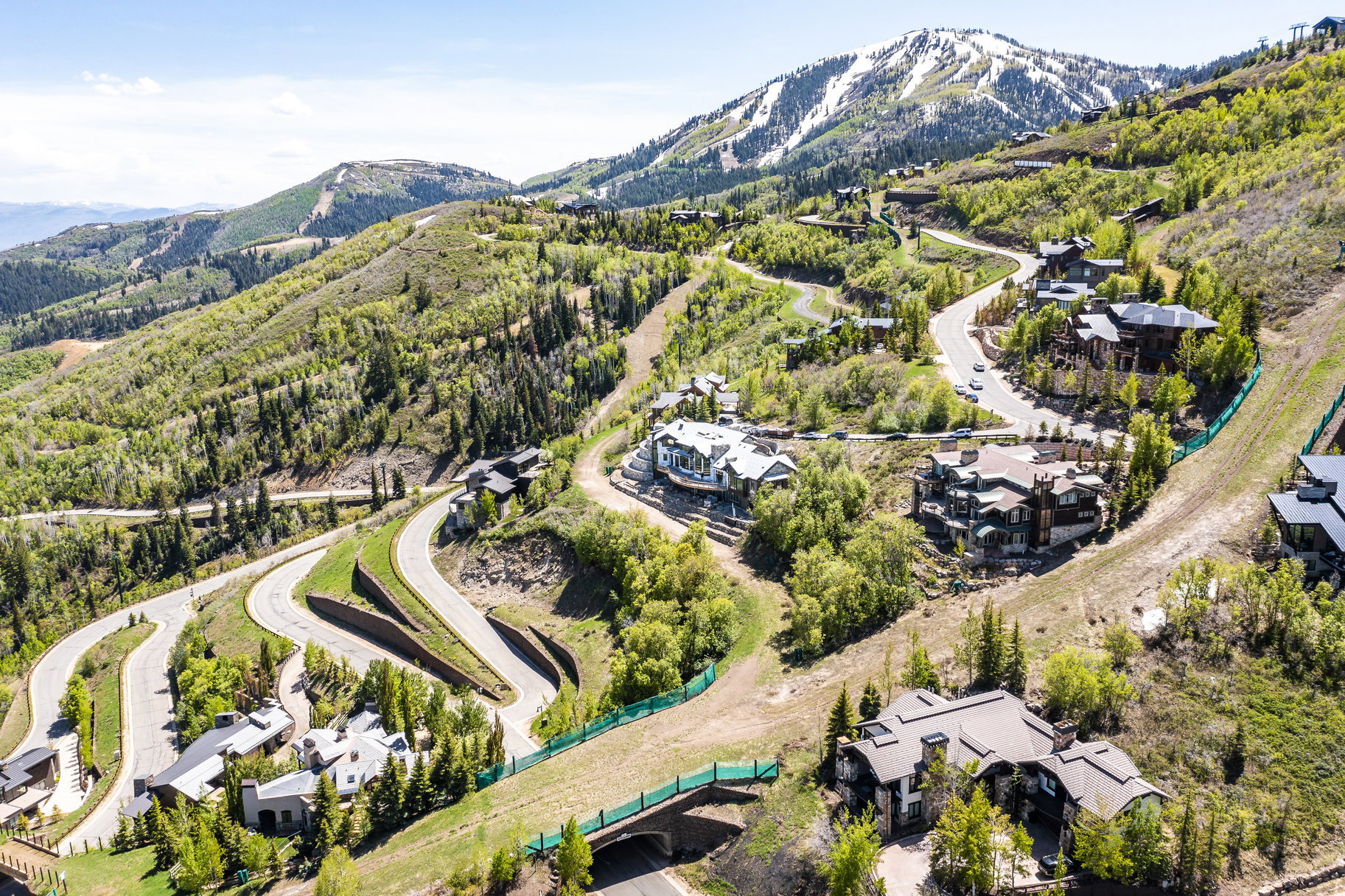 Mountainous landscape featuring residential properties and winding roads