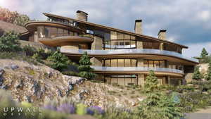 Back of property with a chimney and a balcony