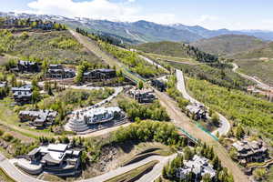 Aerial perspective of suburban area with a mountainous background